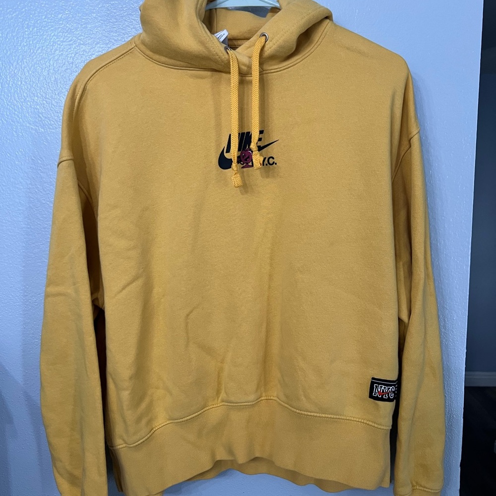 Nike women's "BIG ON THE BIG APPLE" Sportswear Hoodie in yellow